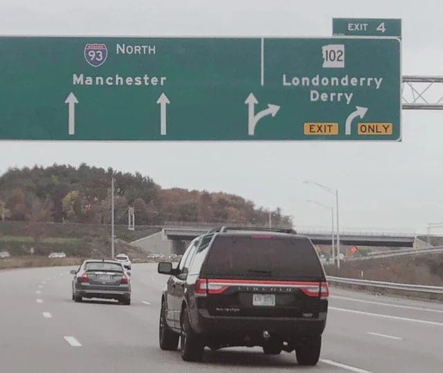 Split commute: Exit 4 for Derry-side, Exit 5 for the orchard-and-airport side in Londonderry, NH