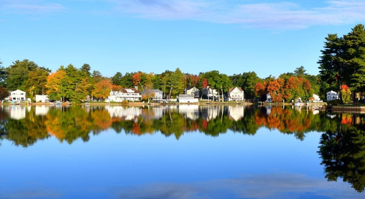 Lakefront Homes Autumn Foliage Water Reflection in Salem, NH