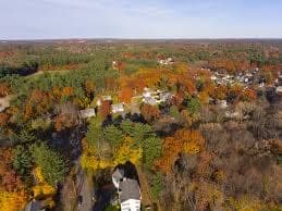 Aerial Autumn Foliage Over Wooded Neighborhoods in Wilmington, MA