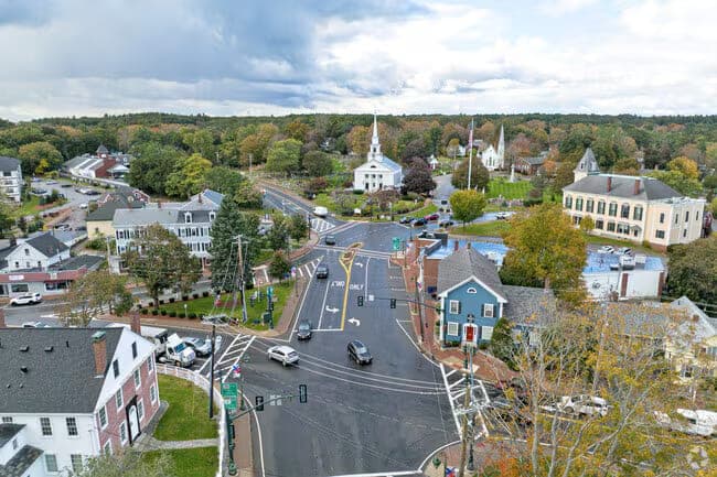 Aerial Autumn Town Center White Church Steeples in Chelmsford, MA
