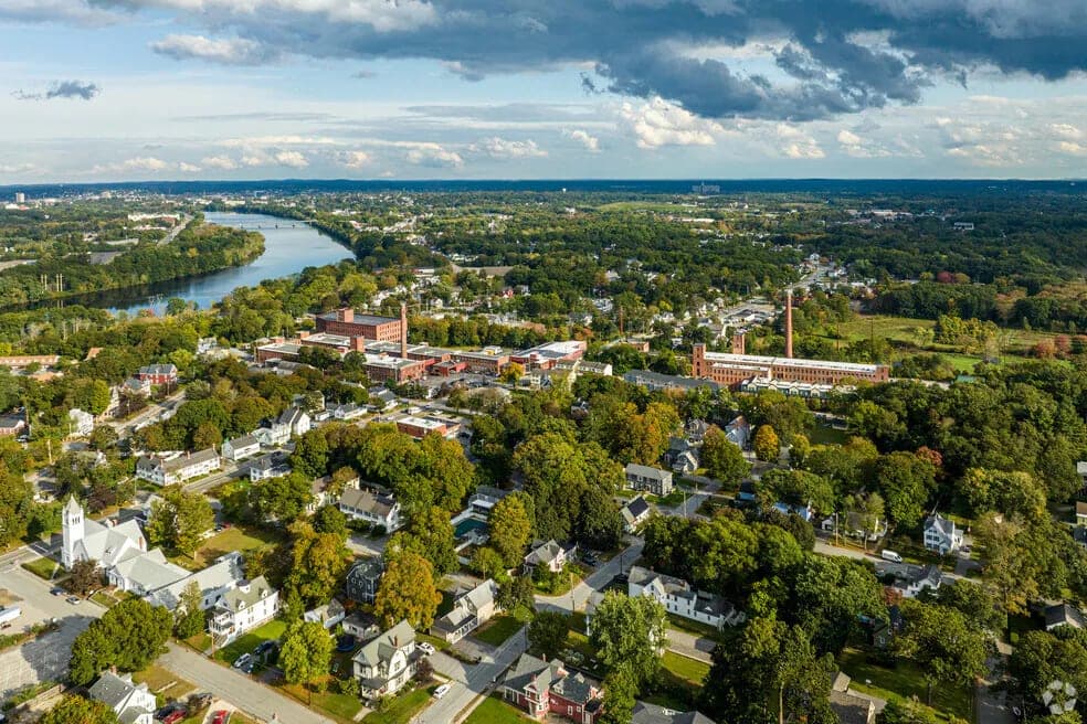 Aerial Green Summer Town Center Along River in Chelmsford, MA