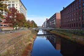 Autumn Canal Reflecting Red Brick Mills in Lawrence, MA
